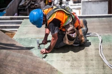 general construction worker working on roof