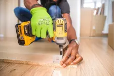 construction worker using a drill